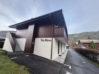Discover 'The Mews,' a charming property offering a blend of modern design and natural surroundings.