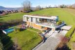 Discover modern luxury in this stunning property featuring a sleek design and breathtaking views.