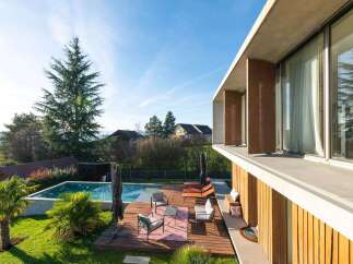 Experience luxury living in this stunning property with a private pool and expansive outdoor deck.