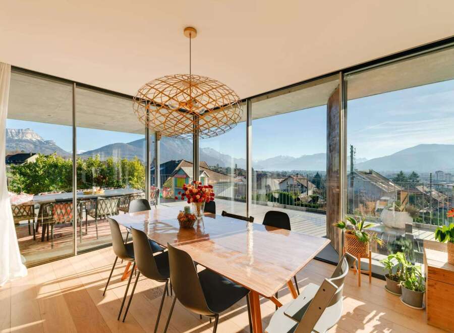 Experience breathtaking views from this stunning property, featuring expansive windows that frame the majestic mountains.