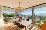 Experience breathtaking views from this stunning property, featuring expansive windows that frame the majestic mountains.