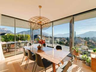 Experience breathtaking views from this stunning property, featuring expansive windows that frame the majestic mountains.