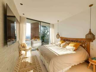 Experience luxury living in this stunning bedroom with breathtaking views.