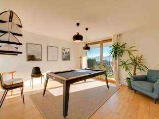 This stunning property boasts a modern interior with a pool table, perfect for entertaining.