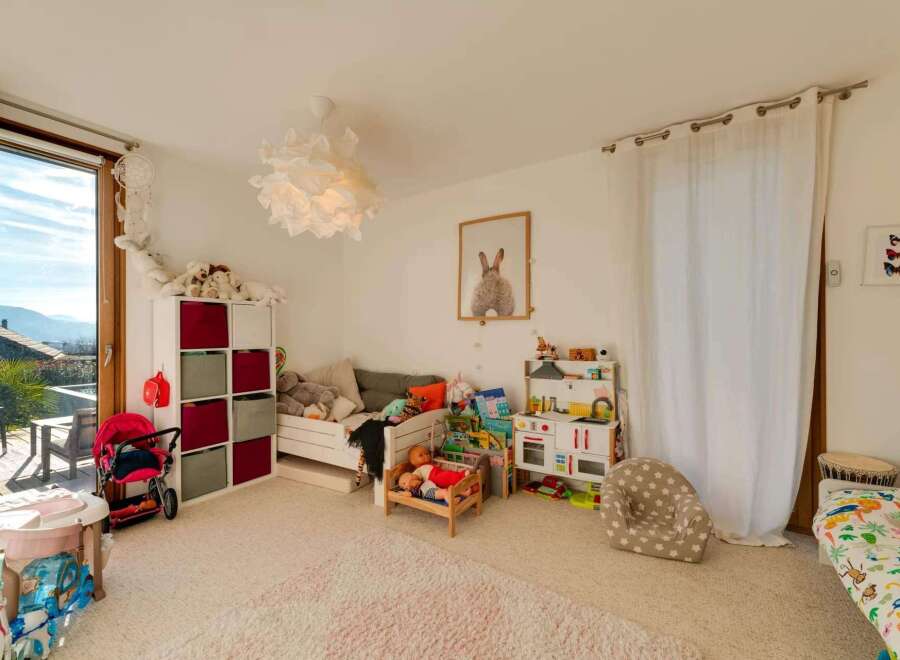 This charming children's room offers a bright and inviting space for play and relaxation.