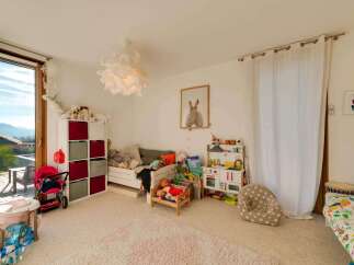 This charming children's room offers a bright and inviting space for play and relaxation.