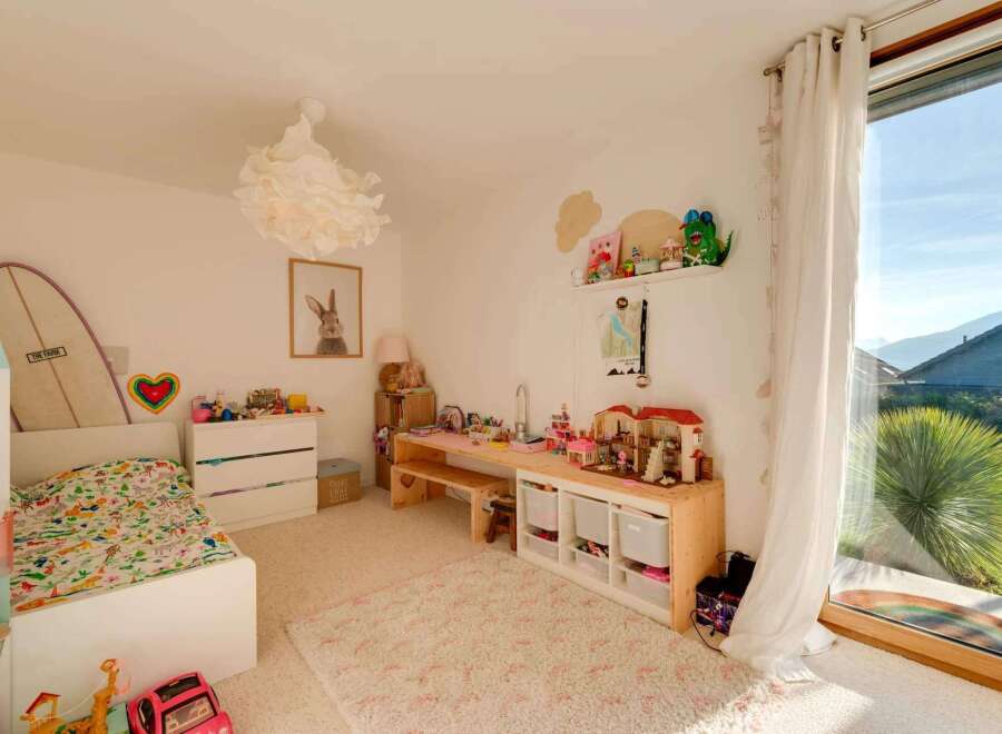 This charming children's room offers a bright and inviting space for play and relaxation.