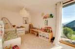 This charming children's room offers a bright and inviting space for play and relaxation.