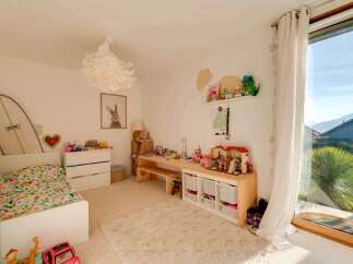 This charming children's room offers a bright and inviting space for play and relaxation.