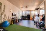 This modern home gym offers a dedicated space for fitness enthusiasts.