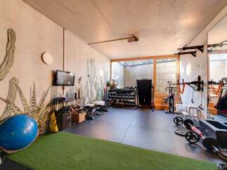 This modern home gym offers a dedicated space for fitness enthusiasts.