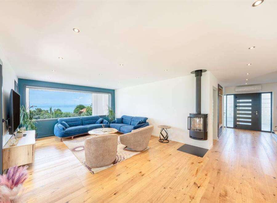 This stunning property boasts a modern living space with a panoramic view.