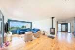 This stunning property boasts a modern living space with a panoramic view.