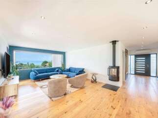 This stunning property boasts a modern living space with a panoramic view.
