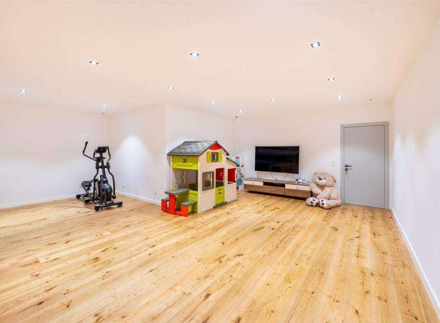 This spacious room offers a versatile space for various activities.