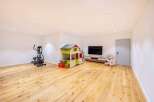 This spacious room offers a versatile space for various activities.