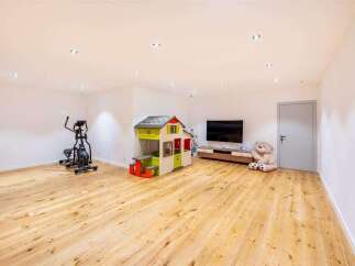 This spacious room offers a versatile space for various activities.