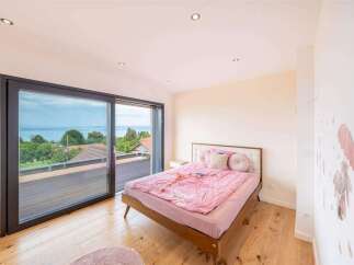 This stunning bedroom offers breathtaking views and a serene atmosphere.