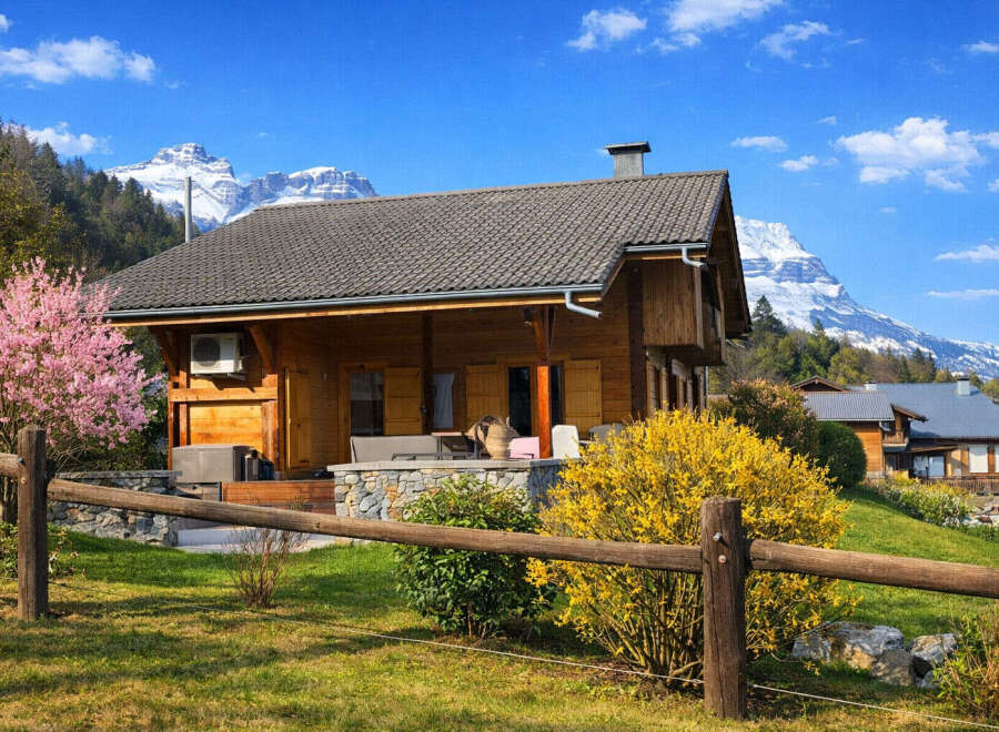 Escape to the tranquility of this charming wooden cabin nestled amidst breathtaking mountain scenery.