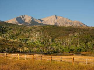 Discover the tranquility of this stunning property, nestled against a backdrop of majestic mountains.