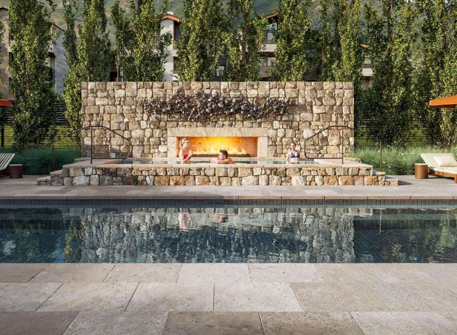 Experience luxury living at its finest with this stunning property featuring a beautiful outdoor pool and a cozy fireplace.