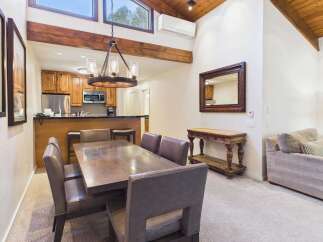 Experience comfortable living in this inviting dining and kitchen area, perfect for entertaining.