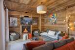Experience the epitome of luxury living in this stunning property, featuring a cozy living room with a fireplace.