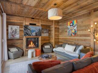 Experience the epitome of luxury living in this stunning property, featuring a cozy living room with a fireplace.