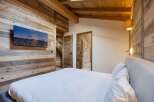 Experience rustic elegance in this stunning bedroom.