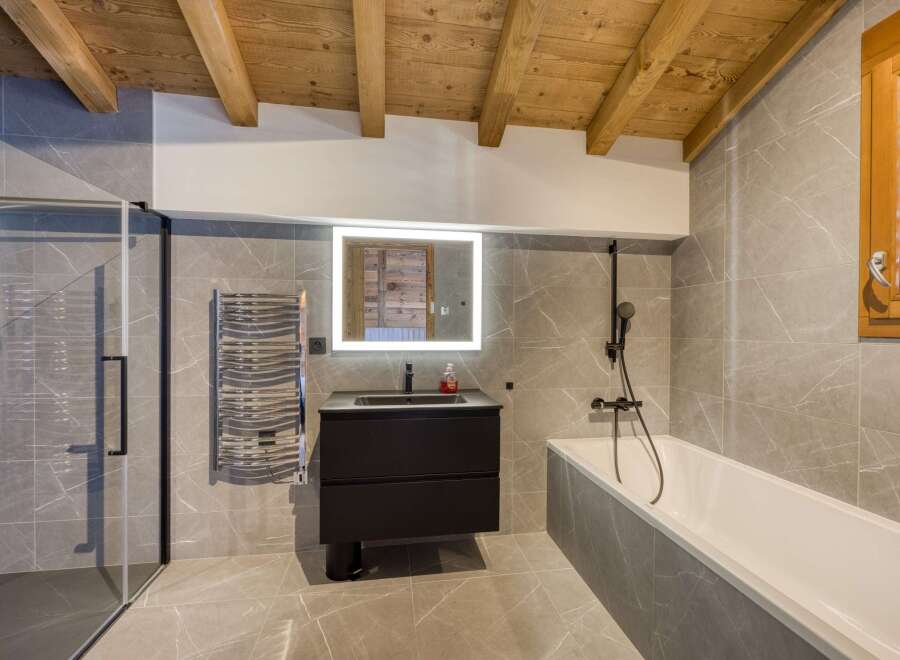 Step into luxury with this stunning bathroom featuring a sleek, modern design.
