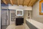 Step into luxury with this stunning bathroom featuring a sleek, modern design.