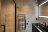 This modern bathroom features sleek design elements and luxurious finishes.