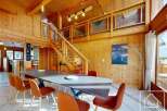 Experience the warmth of this stunning wooden chalet, perfect for a luxurious getaway.