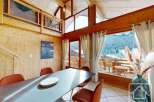Experience the charm of this stunning property, boasting a spacious dining area with a modern table and stylish chairs.