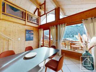 Experience the charm of this stunning property, boasting a spacious dining area with a modern table and stylish chairs.