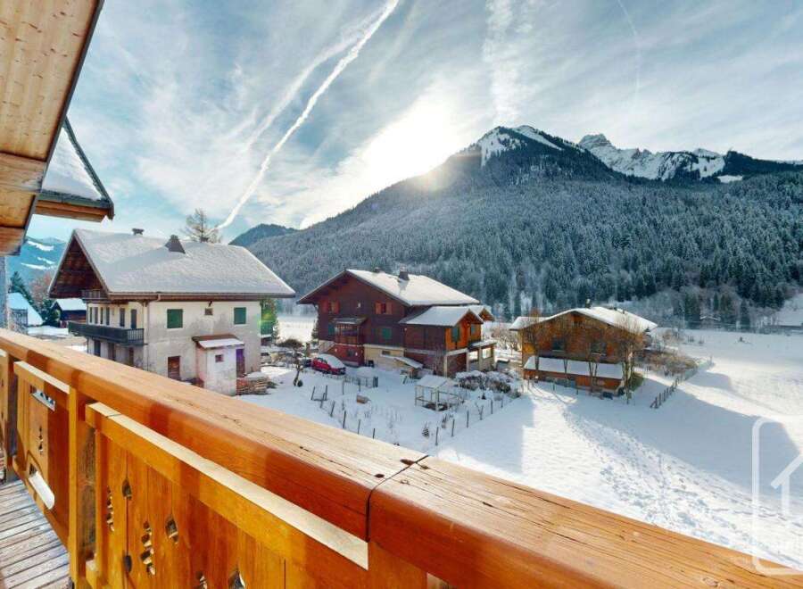 Experience the charm of alpine living with this stunning property, offering breathtaking views of snow-capped mountains and picturesque chalets.