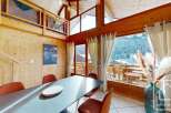 Experience the charm of this stunning property, featuring a beautifully designed dining area with a modern table and comfortable seating.