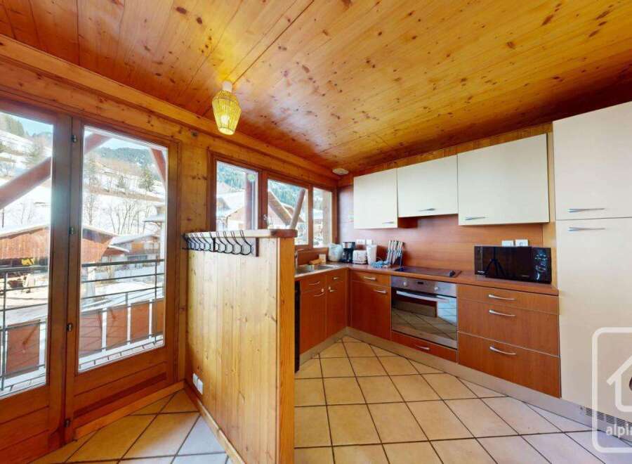 Discover the charm of this stunning property, featuring a cozy kitchen with wooden accents and modern appliances.