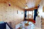 This charming children's room features warm wooden paneling and a cozy atmosphere.