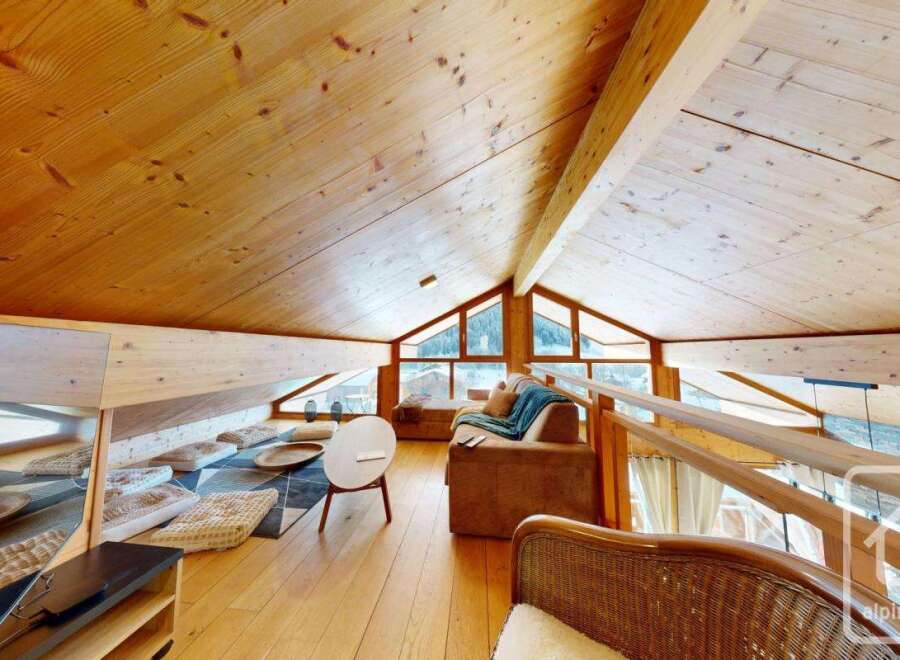 Discover the charm of this stunning property, featuring a beautifully designed interior with exposed wooden beams and a cozy, inviting atmosphere.