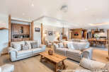 Experience luxury living in this stunning property, featuring a spacious living area with comfortable seating and elegant decor.