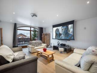 Experience luxury living in this stunning property, featuring a state-of-the-art home theater with a large screen perfect for movie nights.