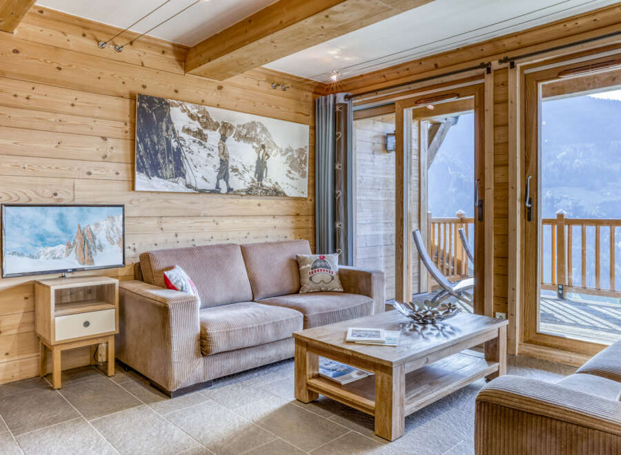 Experience the charm of this cozy living space, perfect for relaxing after a day of mountain adventures.