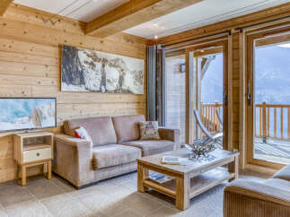 Experience the charm of this cozy living space, perfect for relaxing after a day of mountain adventures.