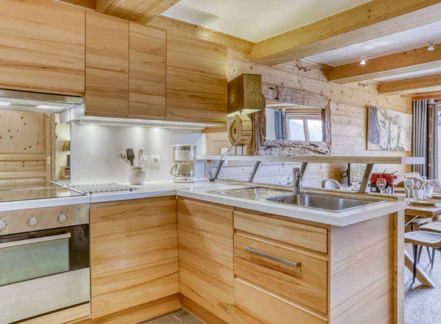This stunning kitchen boasts a warm and inviting atmosphere with its natural wood cabinetry and countertops.