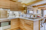 This stunning kitchen boasts a warm and inviting atmosphere with its natural wood cabinetry and countertops.