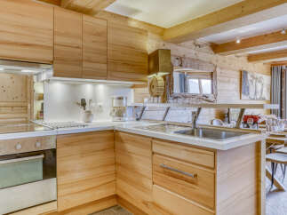 This stunning kitchen boasts a warm and inviting atmosphere with its natural wood cabinetry and countertops.