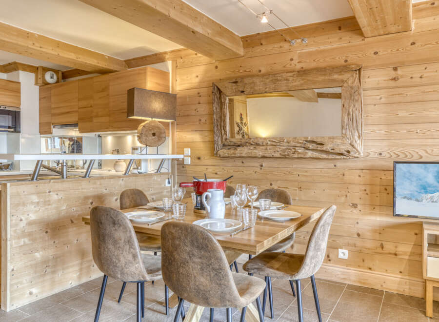 Experience the charm of this stunning property, featuring a cozy dining area perfect for gatherings.