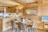Experience the charm of this stunning property, featuring a cozy dining area perfect for gatherings.