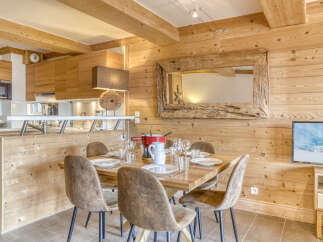 Experience the charm of this stunning property, featuring a cozy dining area perfect for gatherings.